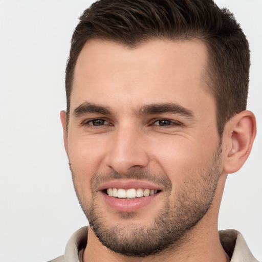 Joyful white young-adult male with short  brown hair and brown eyes