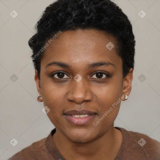 Joyful black young-adult female with short  black hair and brown eyes