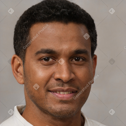 Joyful latino young-adult male with short  brown hair and brown eyes