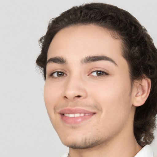 Joyful white young-adult male with medium  brown hair and brown eyes