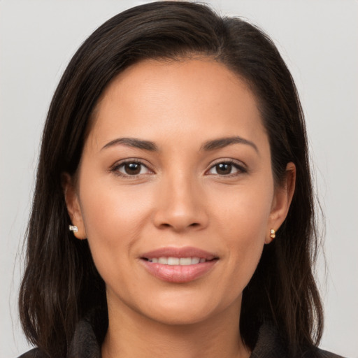 Joyful white young-adult female with long  brown hair and brown eyes