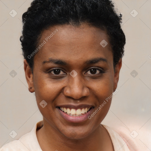 Joyful black young-adult female with short  brown hair and brown eyes