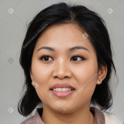 Joyful asian young-adult female with medium  black hair and brown eyes