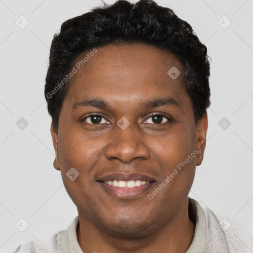 Joyful black young-adult male with short  black hair and brown eyes