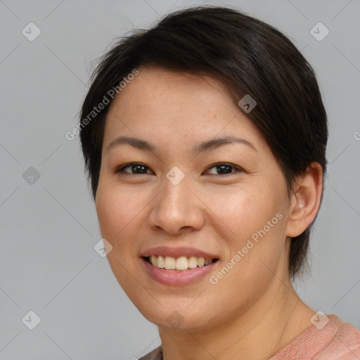 Joyful asian young-adult female with short  brown hair and brown eyes