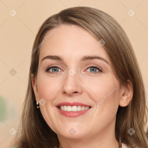 Joyful white young-adult female with long  brown hair and grey eyes