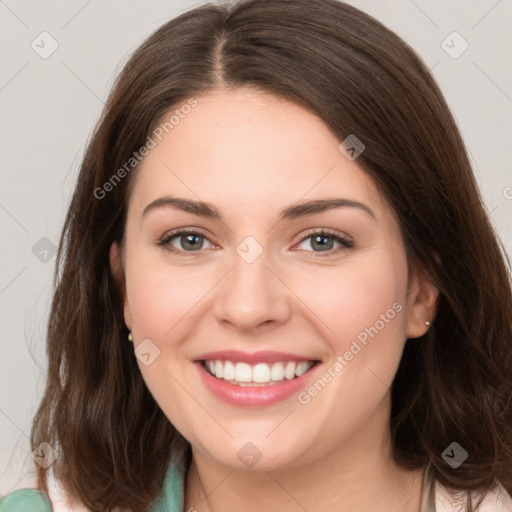 Joyful white young-adult female with medium  brown hair and green eyes