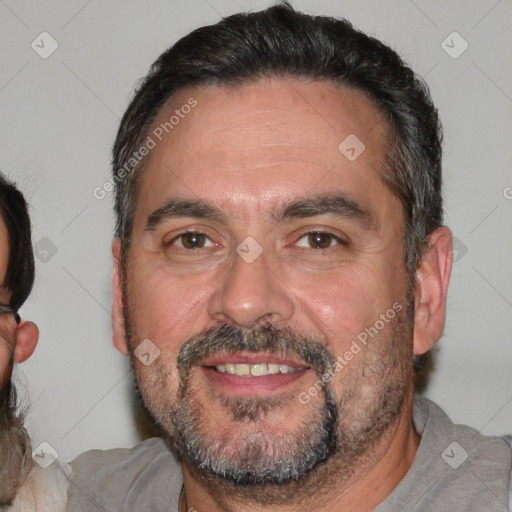 Joyful white adult male with short  black hair and brown eyes