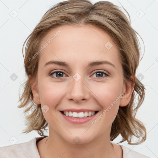 Joyful white young-adult female with medium  brown hair and blue eyes