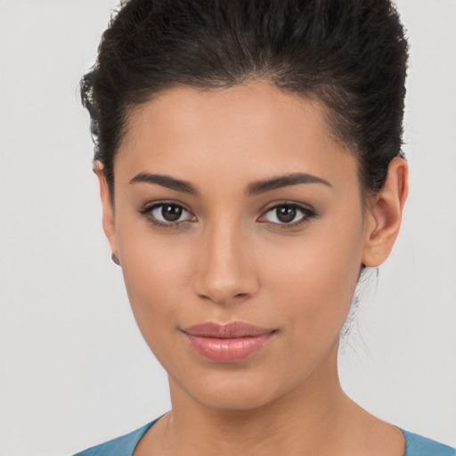 Joyful latino young-adult female with short  brown hair and brown eyes