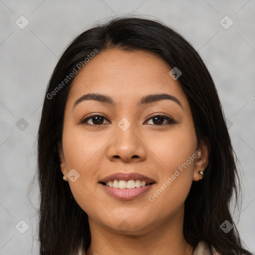 Joyful latino young-adult female with long  black hair and brown eyes