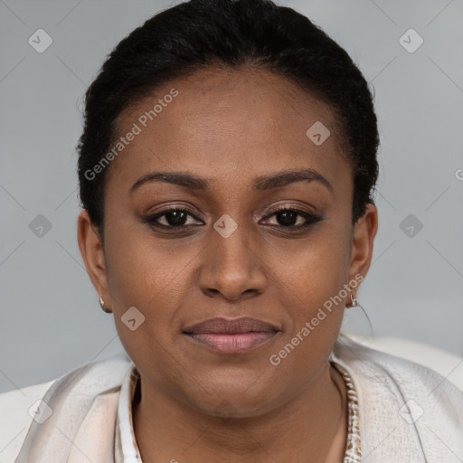 Joyful black young-adult female with short  brown hair and brown eyes
