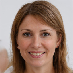 Joyful white young-adult female with long  brown hair and grey eyes