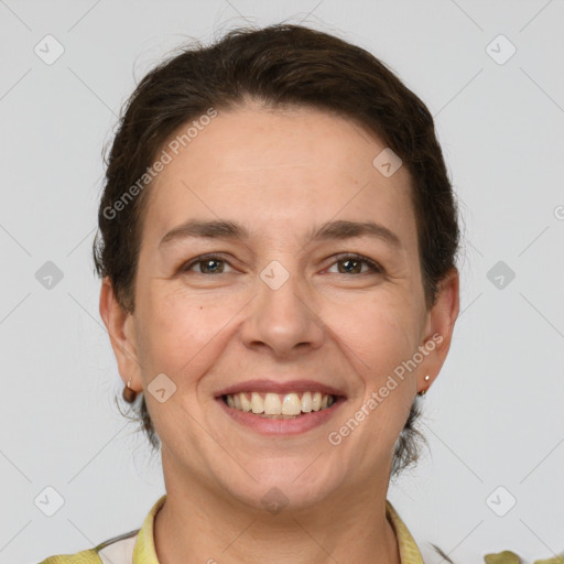 Joyful white adult female with short  brown hair and grey eyes