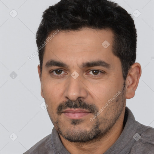 Neutral white young-adult male with short  black hair and brown eyes