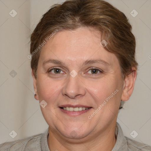 Joyful white adult female with short  brown hair and blue eyes