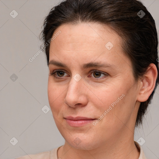 Joyful white adult female with medium  brown hair and brown eyes