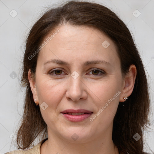 Joyful white adult female with medium  brown hair and brown eyes