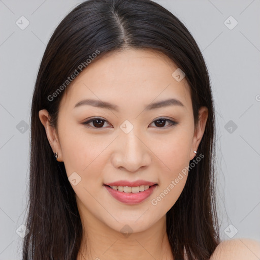 Joyful asian young-adult female with long  brown hair and brown eyes