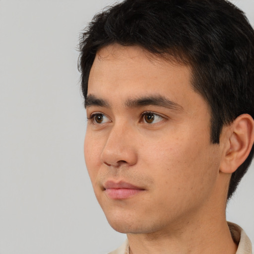 Neutral white young-adult male with short  black hair and brown eyes
