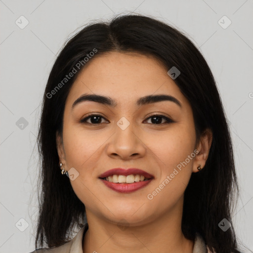 Joyful latino young-adult female with long  brown hair and brown eyes