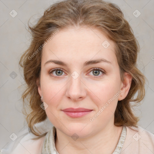 Joyful white young-adult female with medium  brown hair and blue eyes