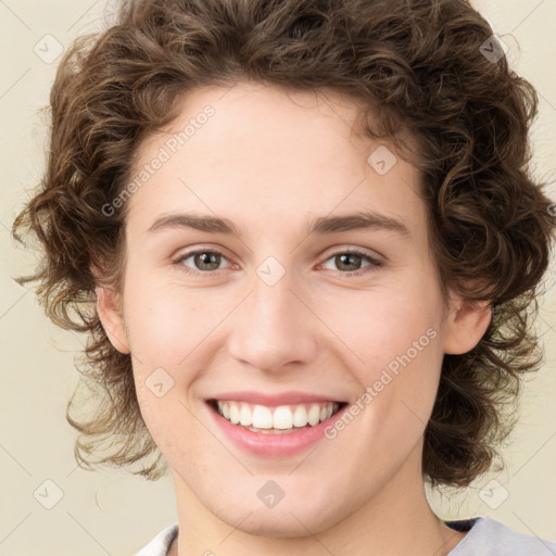 Joyful white young-adult female with medium  brown hair and green eyes