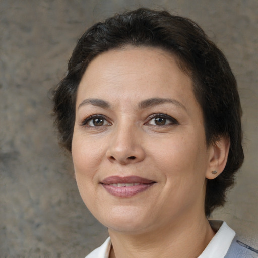 Joyful white adult female with short  brown hair and brown eyes