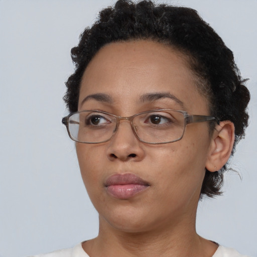 Neutral black adult female with short  brown hair and brown eyes