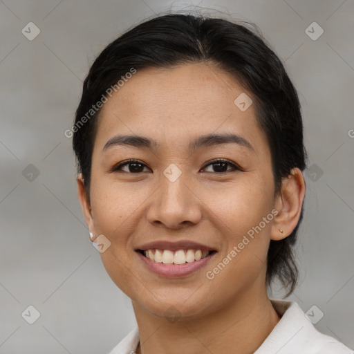 Joyful asian young-adult female with short  brown hair and brown eyes