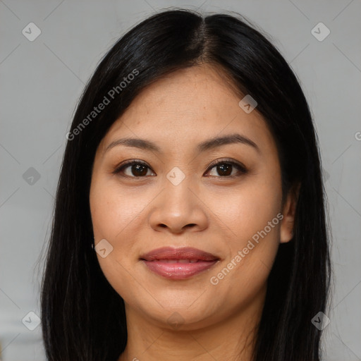 Joyful asian young-adult female with long  brown hair and brown eyes