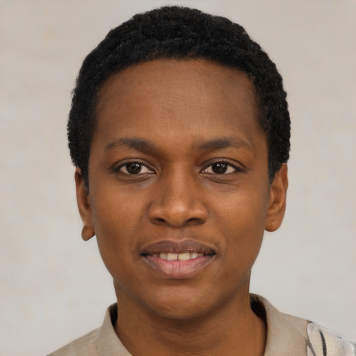 Joyful black young-adult male with short  black hair and brown eyes