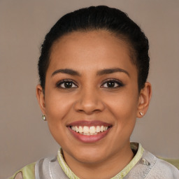 Joyful latino young-adult female with short  brown hair and brown eyes