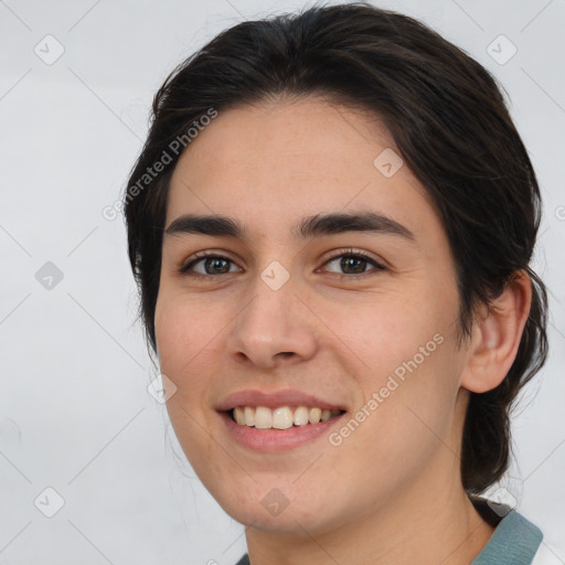 Joyful white young-adult female with medium  brown hair and brown eyes