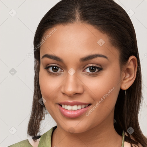 Joyful white young-adult female with long  brown hair and brown eyes