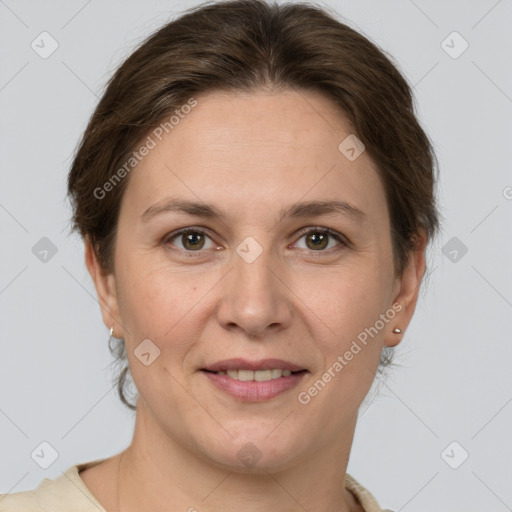 Joyful white adult female with short  brown hair and grey eyes