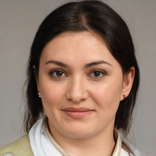 Joyful white young-adult female with medium  brown hair and brown eyes