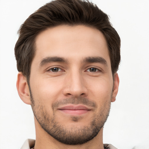 Joyful white young-adult male with short  brown hair and brown eyes