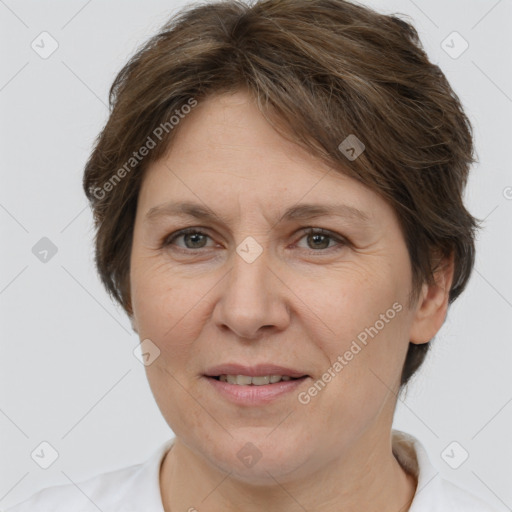 Joyful white adult female with short  brown hair and brown eyes