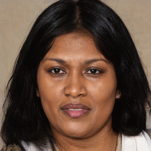 Joyful asian adult female with medium  black hair and brown eyes