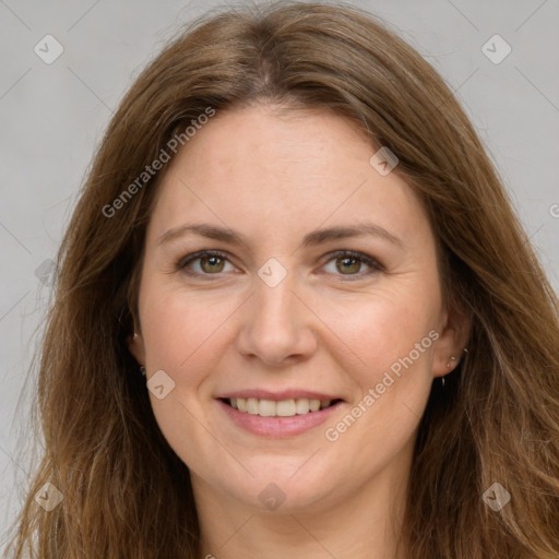 Joyful white adult female with long  brown hair and brown eyes