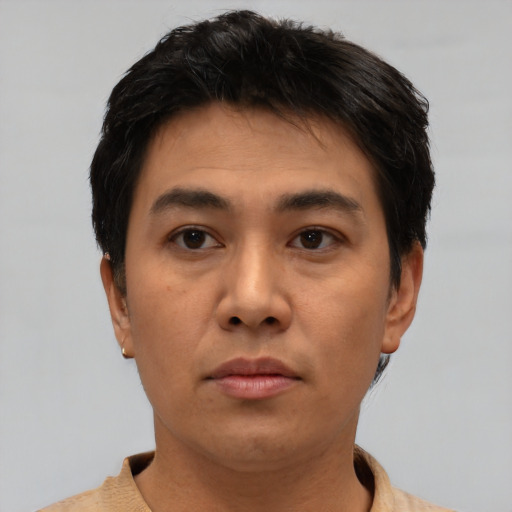Neutral latino young-adult male with short  brown hair and brown eyes