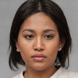 Neutral asian young-adult female with medium  brown hair and brown eyes