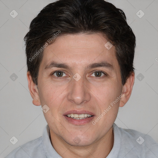 Joyful white adult male with short  brown hair and brown eyes