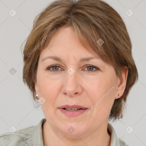 Joyful white adult female with medium  brown hair and grey eyes