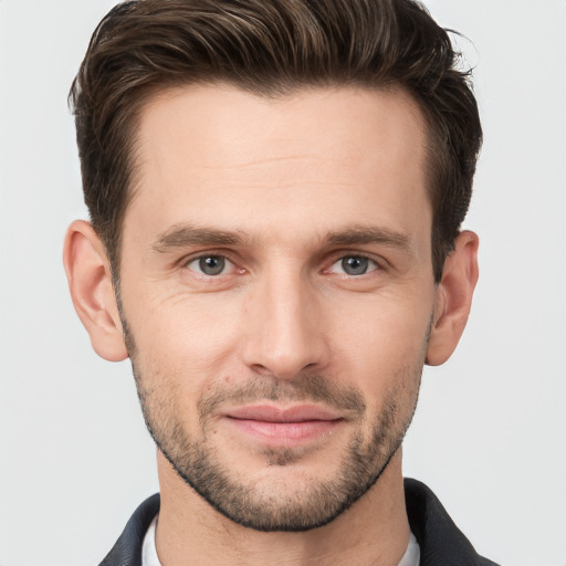 Joyful white young-adult male with short  brown hair and brown eyes