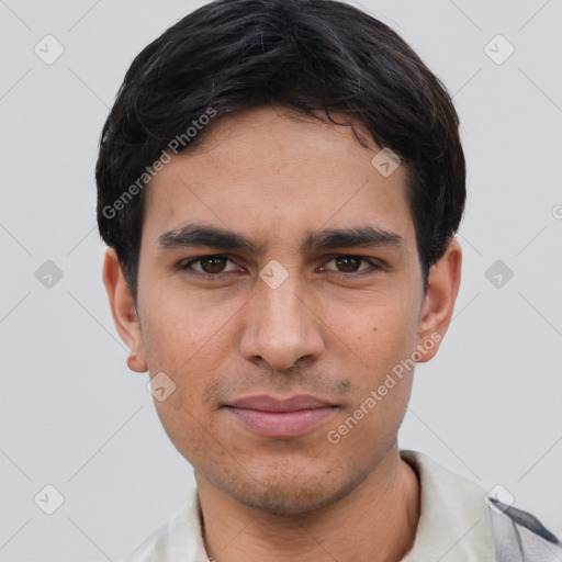 Joyful white young-adult male with short  black hair and brown eyes