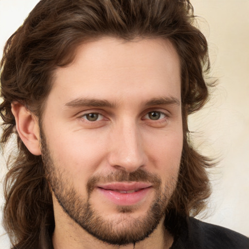 Joyful white young-adult male with medium  brown hair and brown eyes