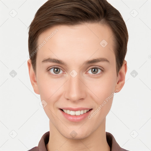 Joyful white young-adult female with short  brown hair and grey eyes