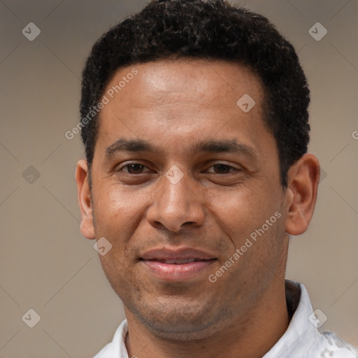 Joyful latino adult male with short  black hair and brown eyes